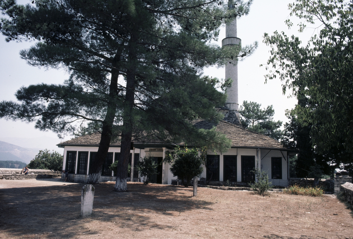 General exterior view of mosque with cemetery in yard