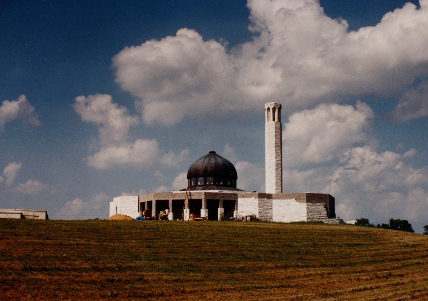 Mosque under construction, with white marble cladding being applied