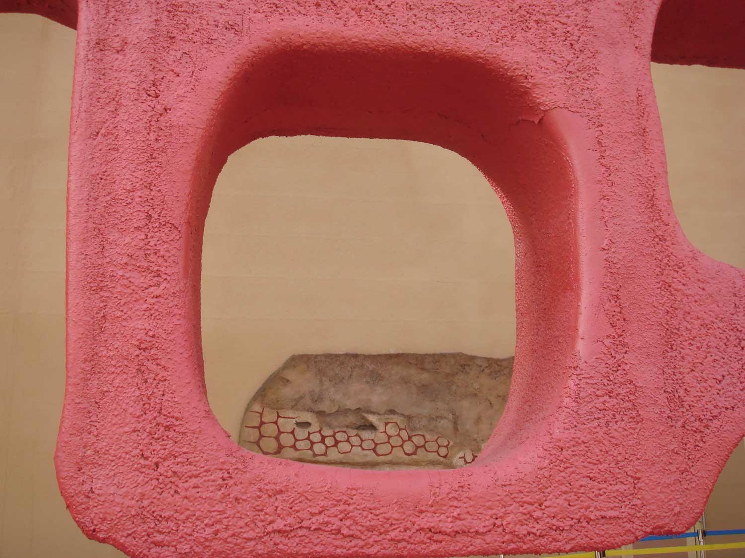 Detail of the notable, decorative, red structure encasing the pavilion.