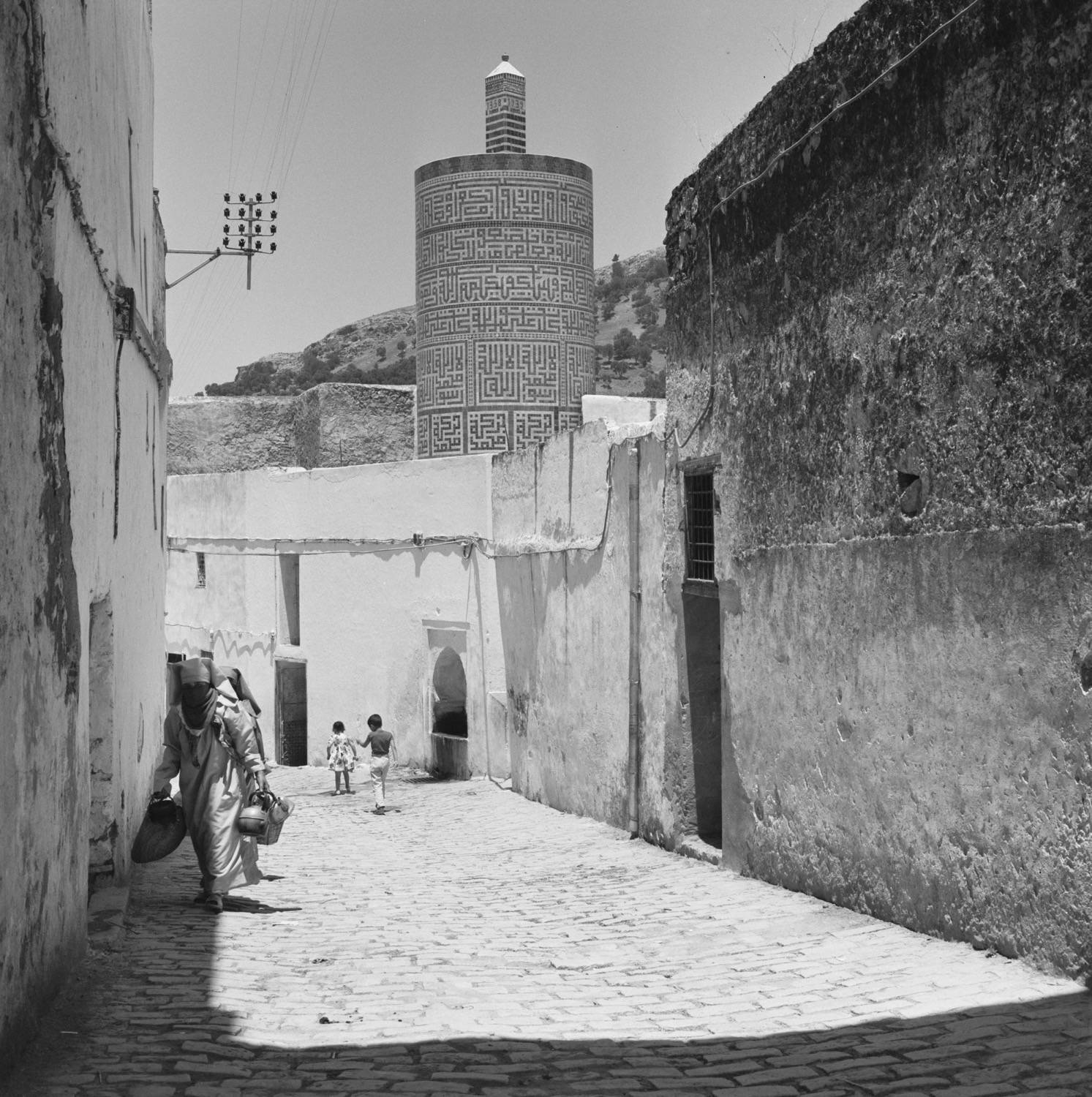 View down the street toward the circular minaret