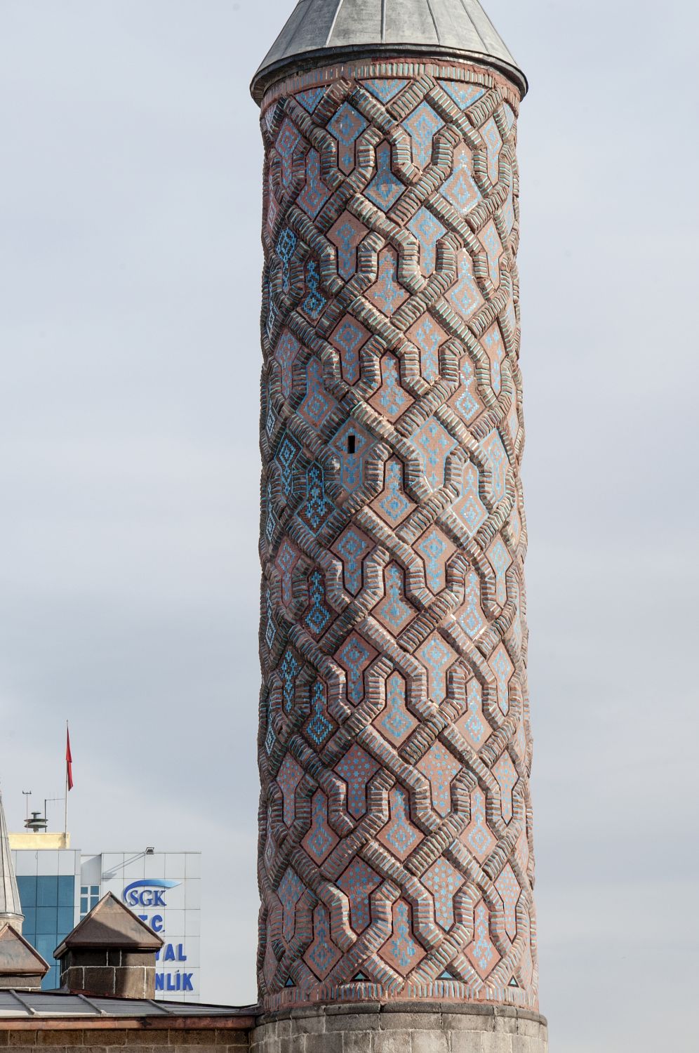 Exterior view of minaret on southern corner of building, showing knotwork decoration.