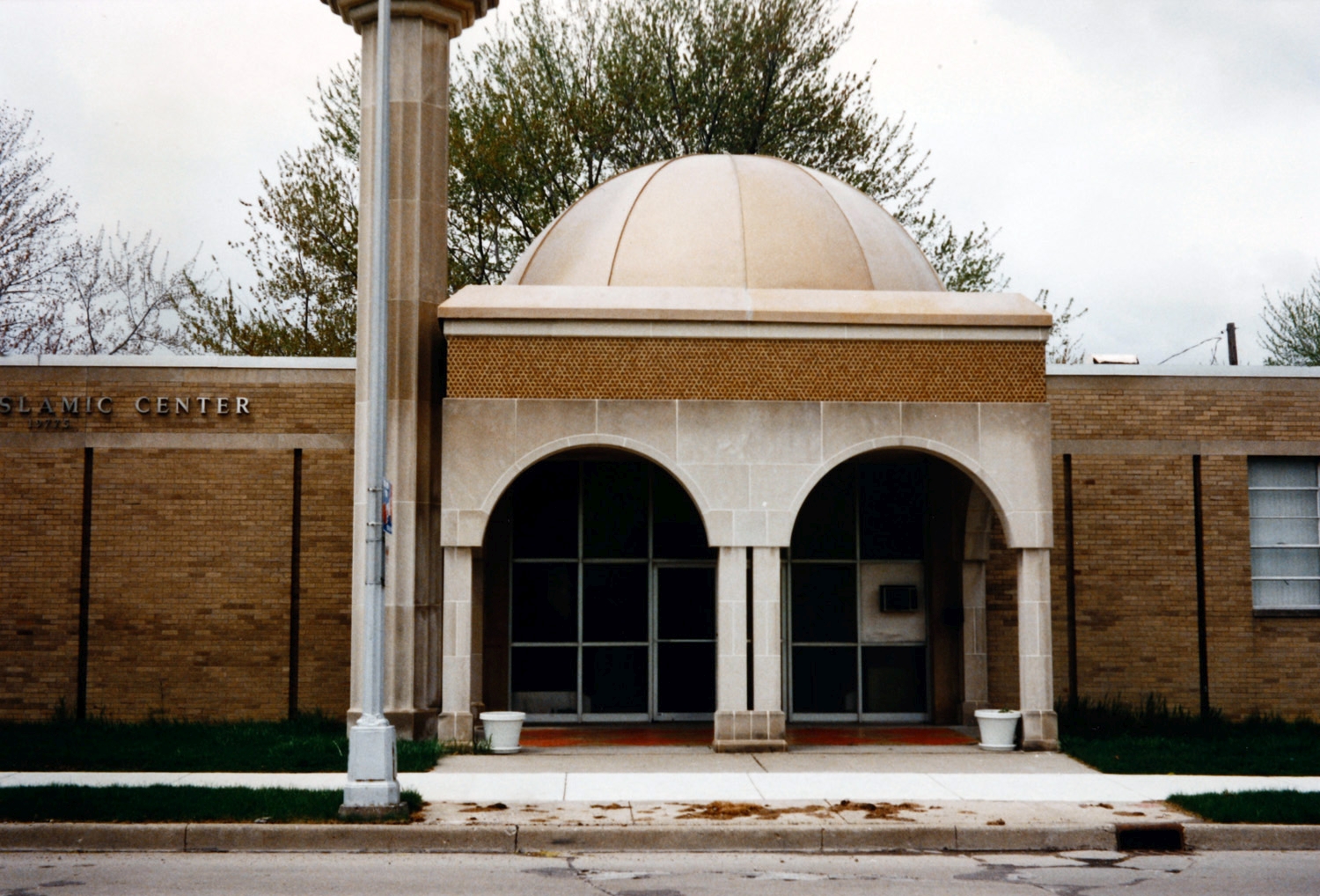Albanian Islamic Center - Entrance portico with dome above, and base of minaret