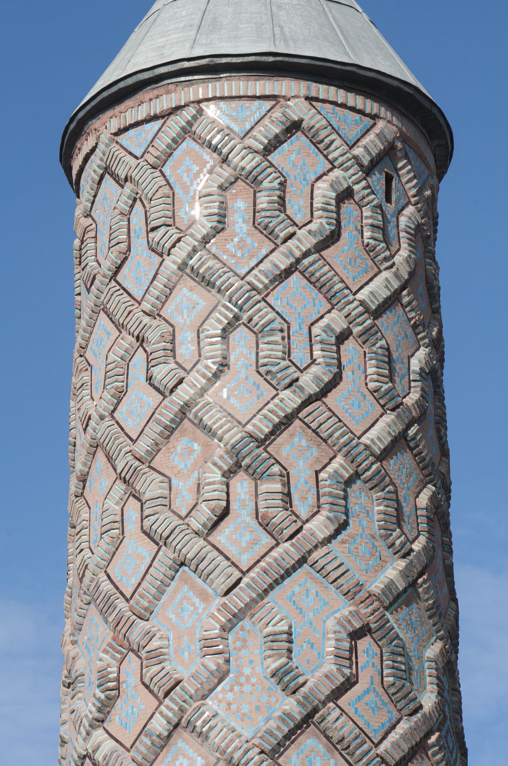 Detail view of minaret showing strapwork ornament in brick.