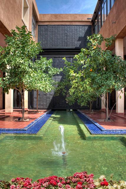 Paved courtyard with pool