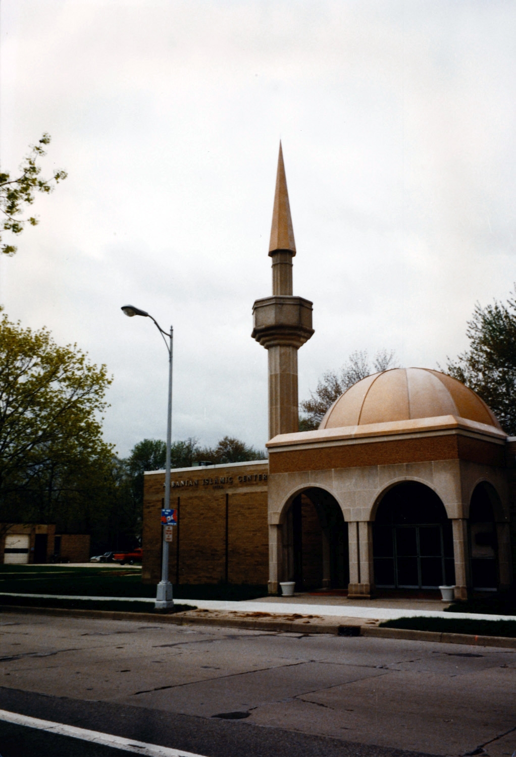 Albanian Islamic Center - Front entrance portico with dome above and minaret