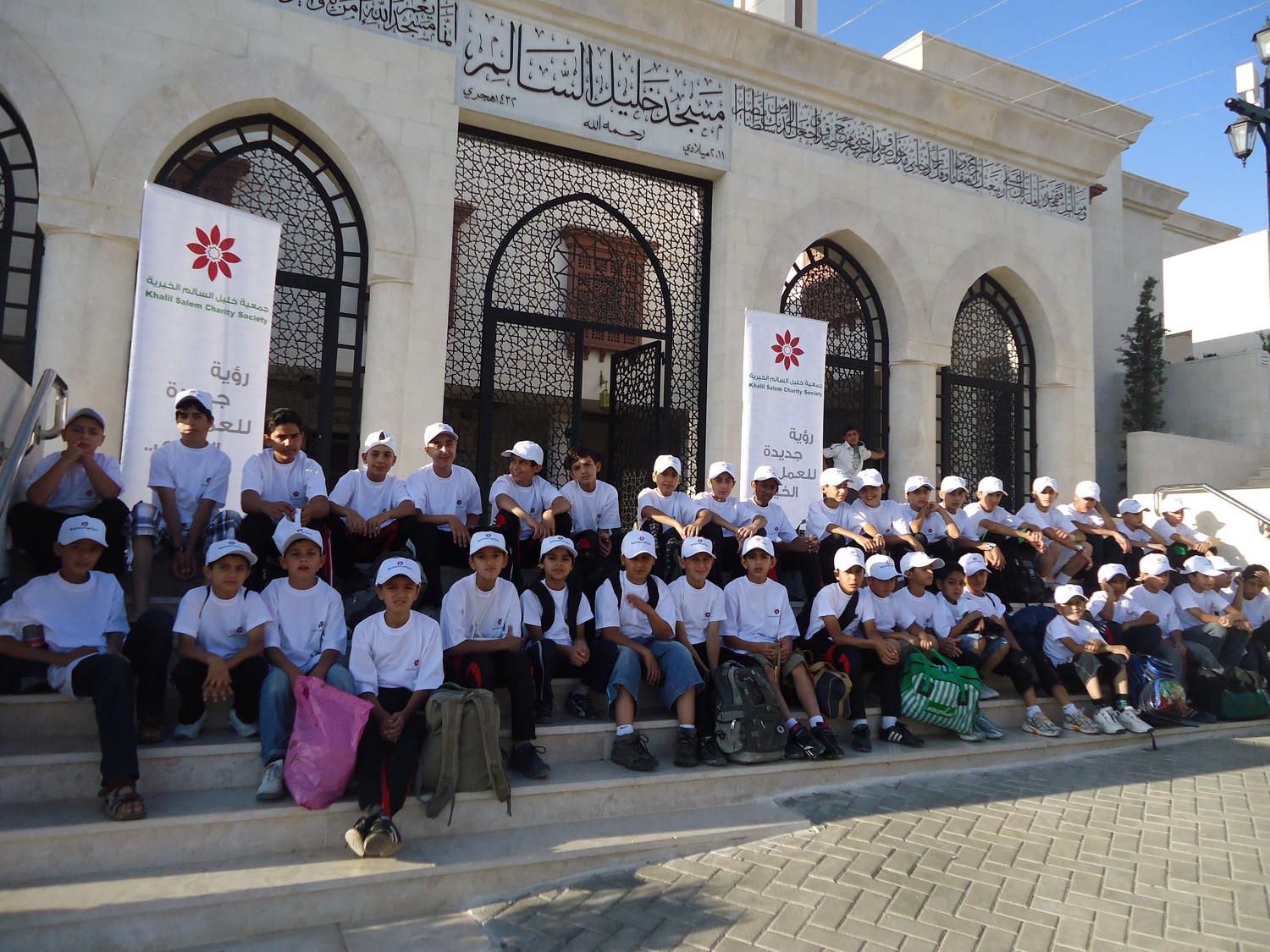 Boys Quran club in front of the main facade of the Mosque