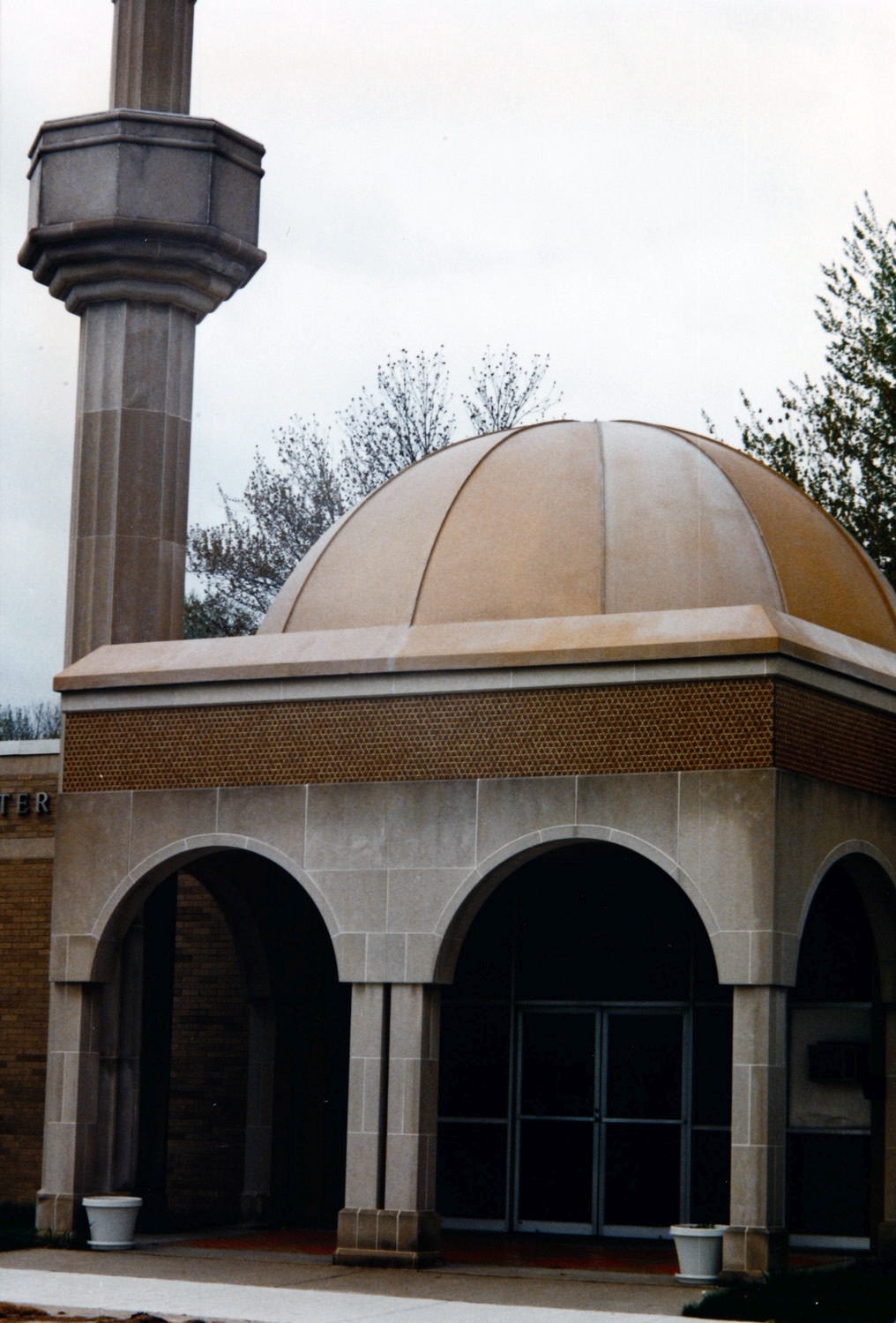 Albanian Islamic Center - Detail of front entrance with dome and partial view of minaret
