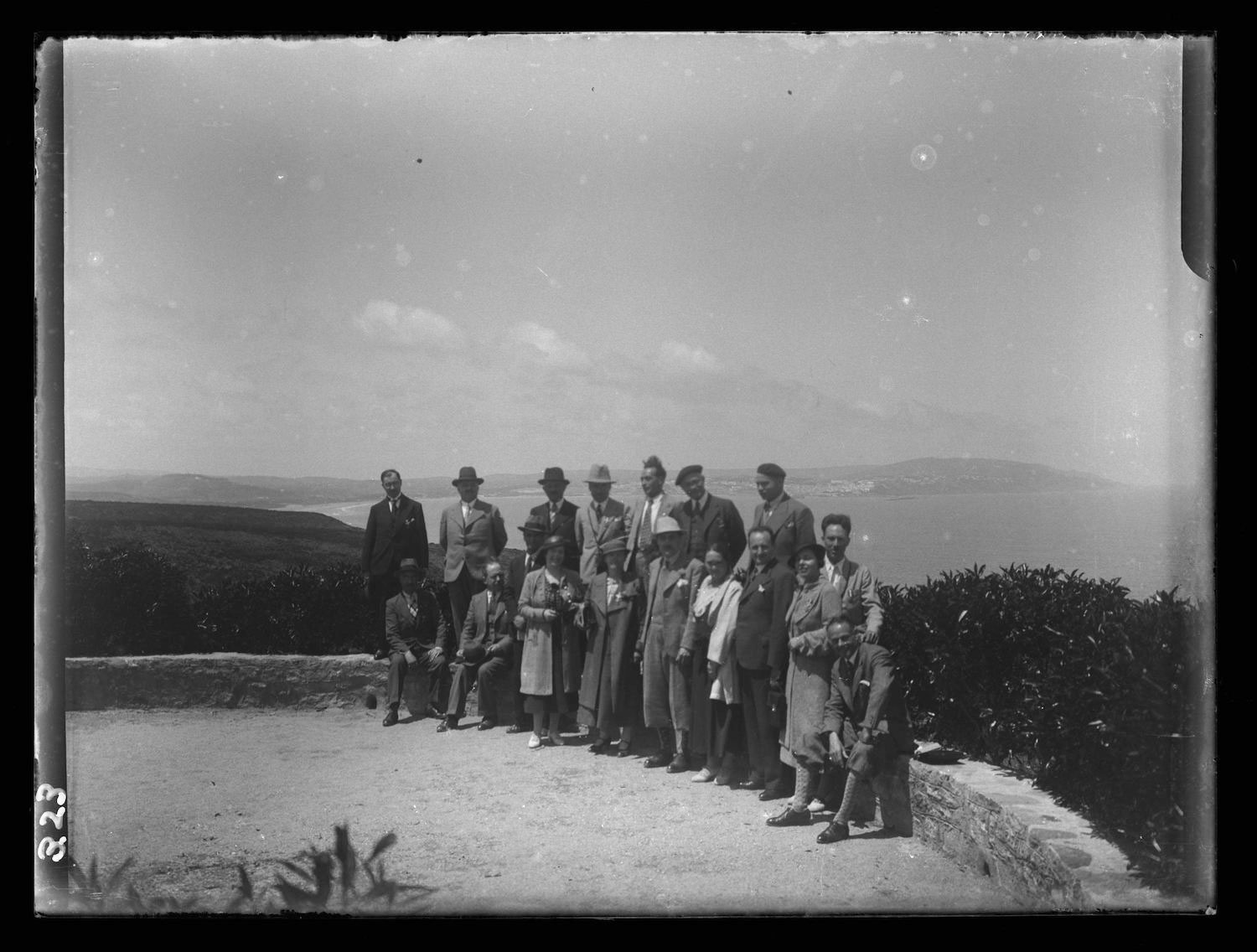 Malabata - A group in European garb poses for a photo with a view of Tangier in the background.