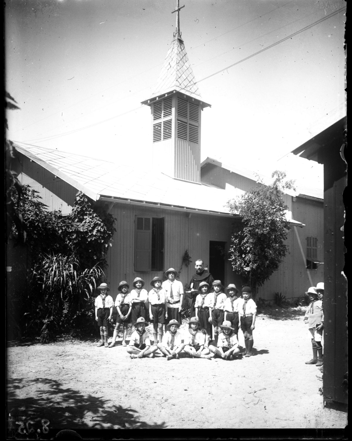 Children and leader in front of church