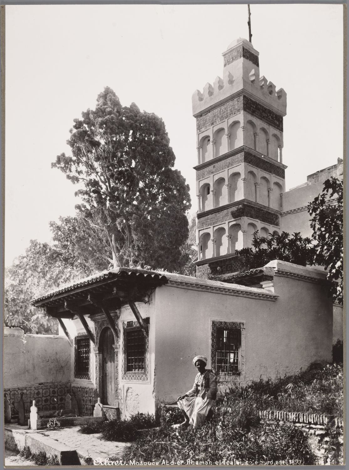 Man sitting in the garden by the mosque