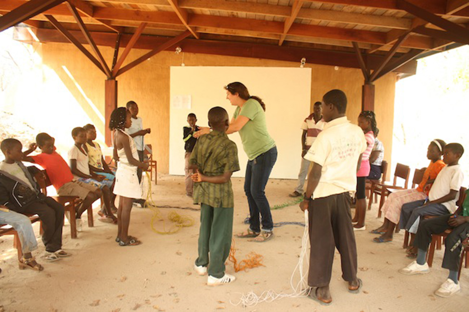 Children learning at the CEC with Adrienne a volunteer environmental educator, outside classroom 