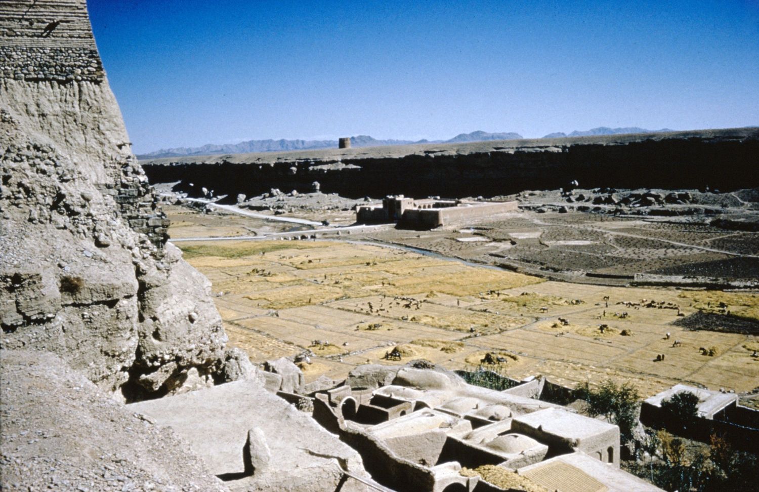 View from citadel facing over river valley. The Caravanserai of Izad Khast is visible in background.