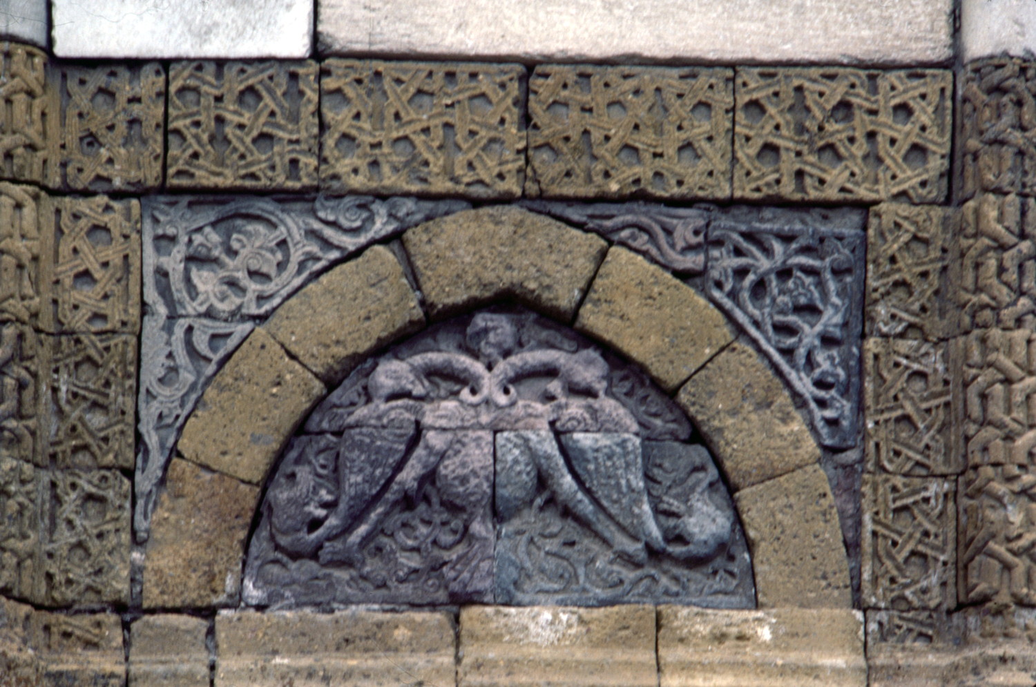 Exterior detail of upper level window with relief above