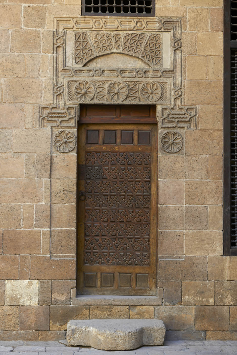 Detail of carved wooden door in the courtyard