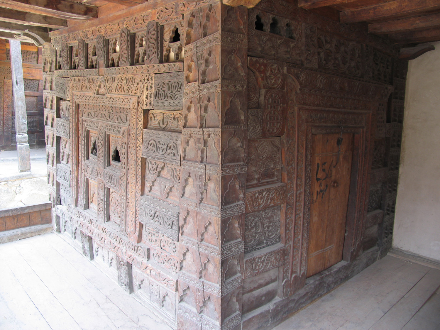 Wooden carving details from Rupikutz Mosque. Traditional wooden architecture and architectural decoration and ornament 