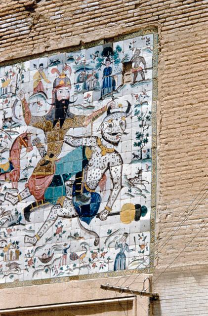 Exterior detail view of tile panel above entrance, showing Rustam (a Persian mythical hero) in struggle with Div-e Sepid ("the White Demon")