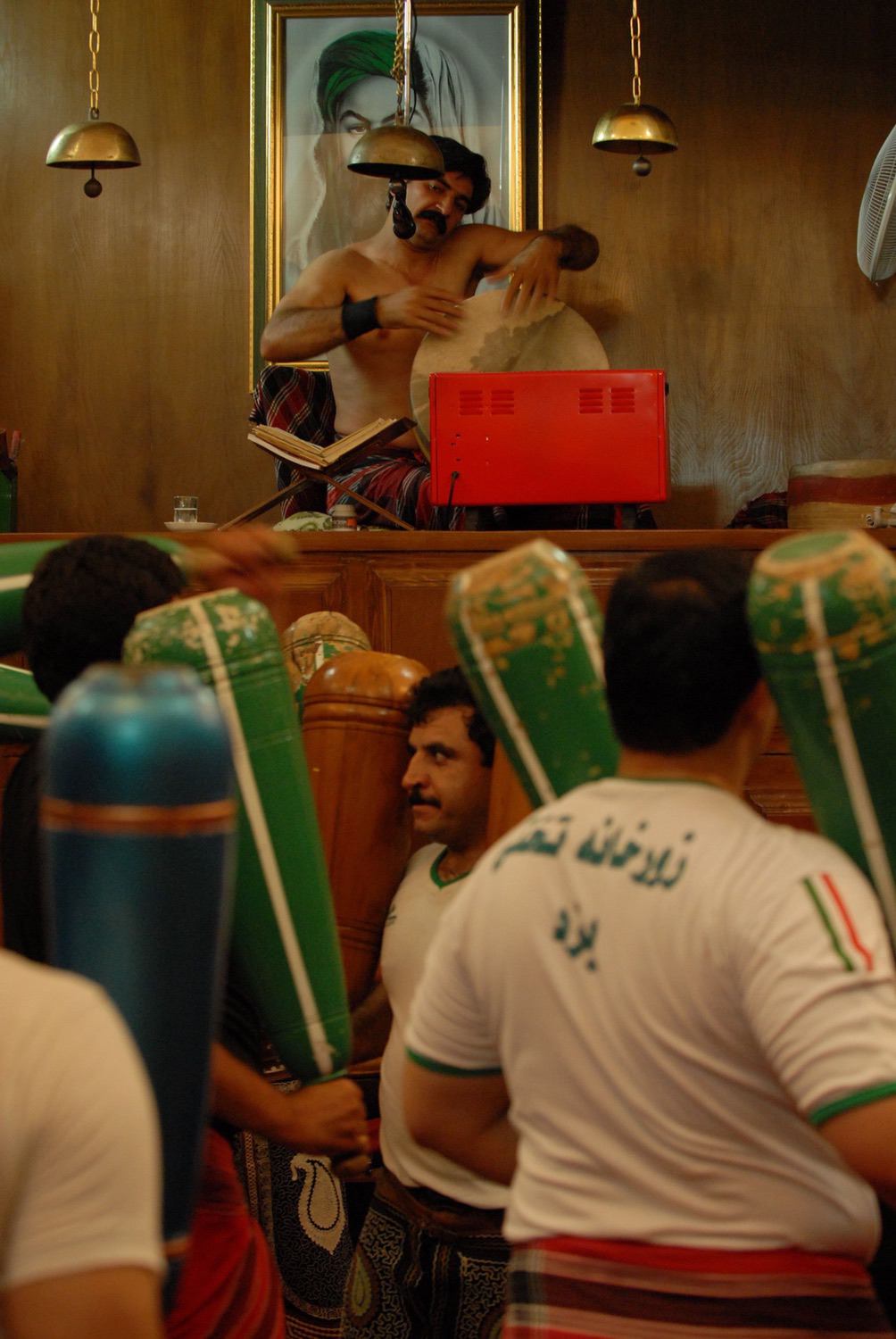 Murshid Alireza Hojjati and athletes performing the mil (“clubs”) exercise