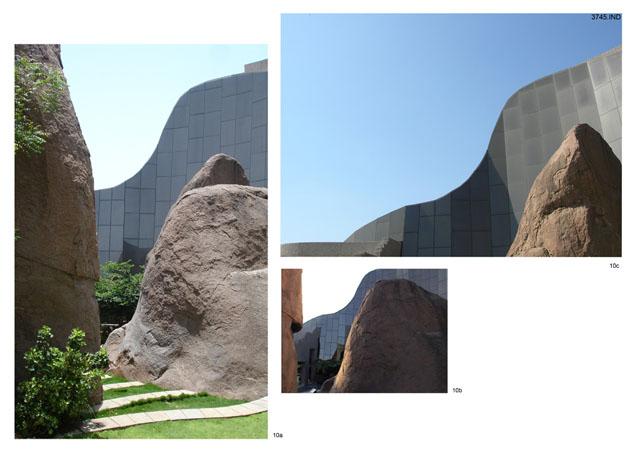 The landscaped court, rocks and glazing. - The glazing and the rocks