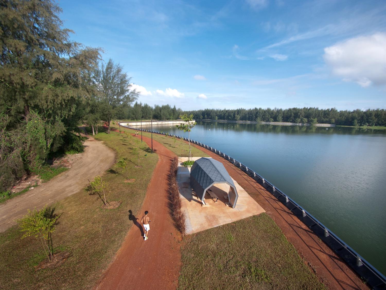 Aerial view of nature walk with rest shelter on the reservoir edge, a future sprawling standalone nature park rich in boidiversity