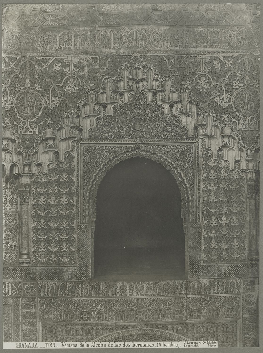 View of a window and carved stucco decoration.