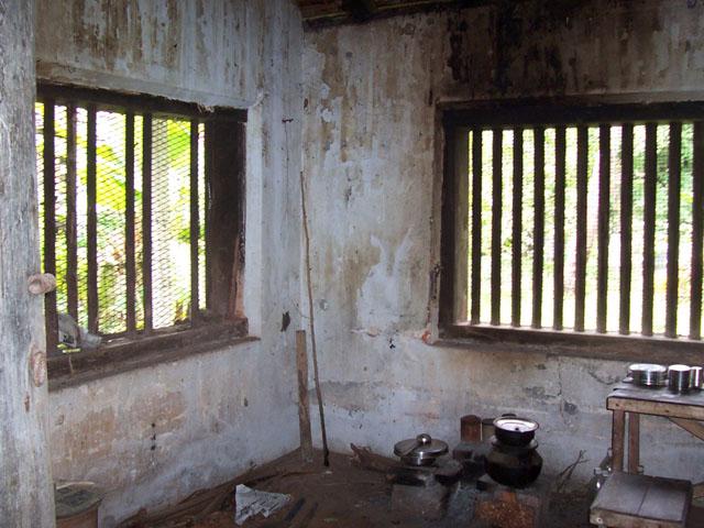 The kitchen as seen from the dining area before restoration