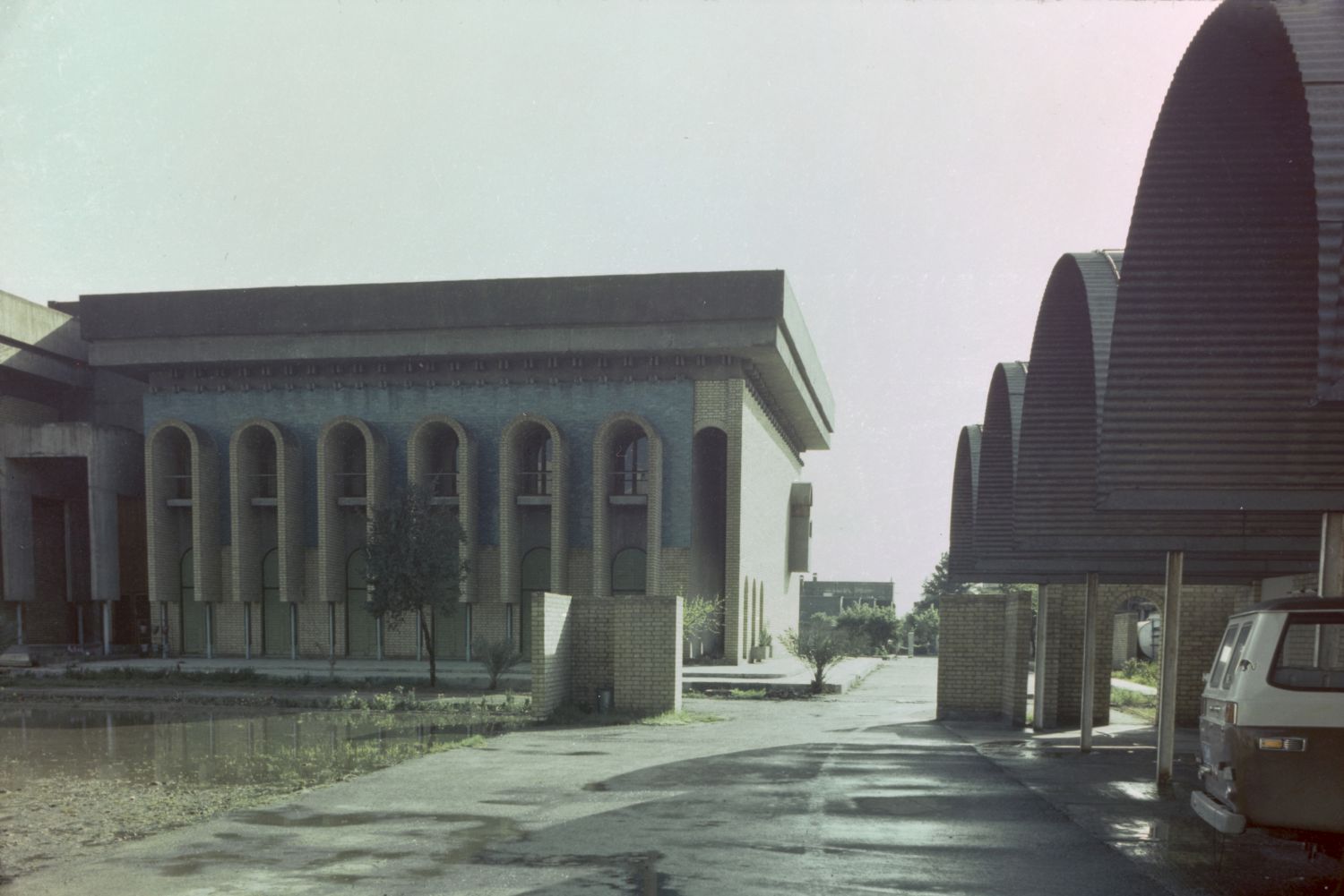 Iraqi Scientific Academy Building - Exterior view, southwest facade, south side. Parking lot visible at right.