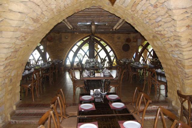 Arched windows in stone are an example of the use of traditional architecural elements in a newly built restaurant
