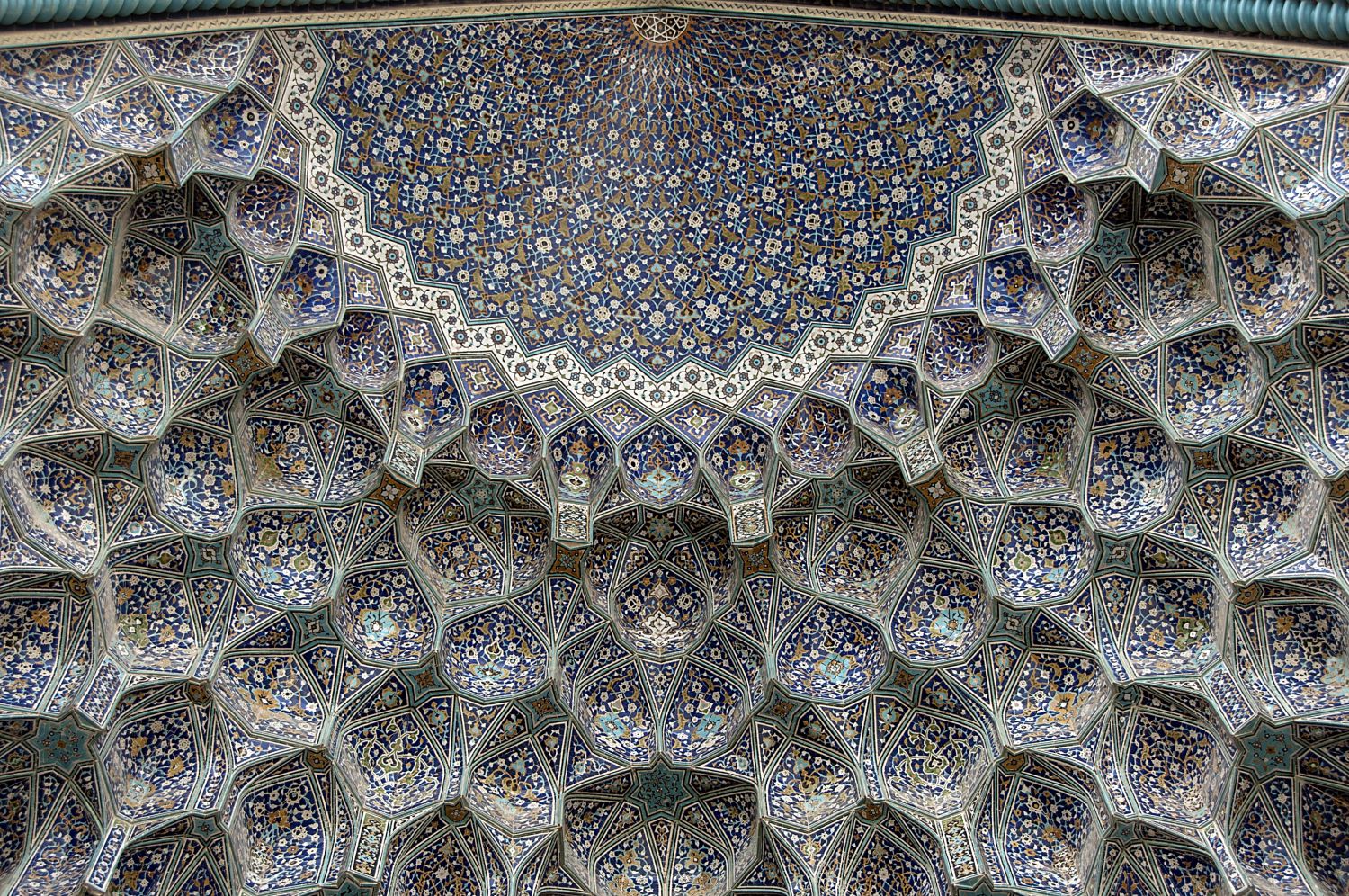 Detail view of muqarnas vault in entrance portal, showing apex of semidome.