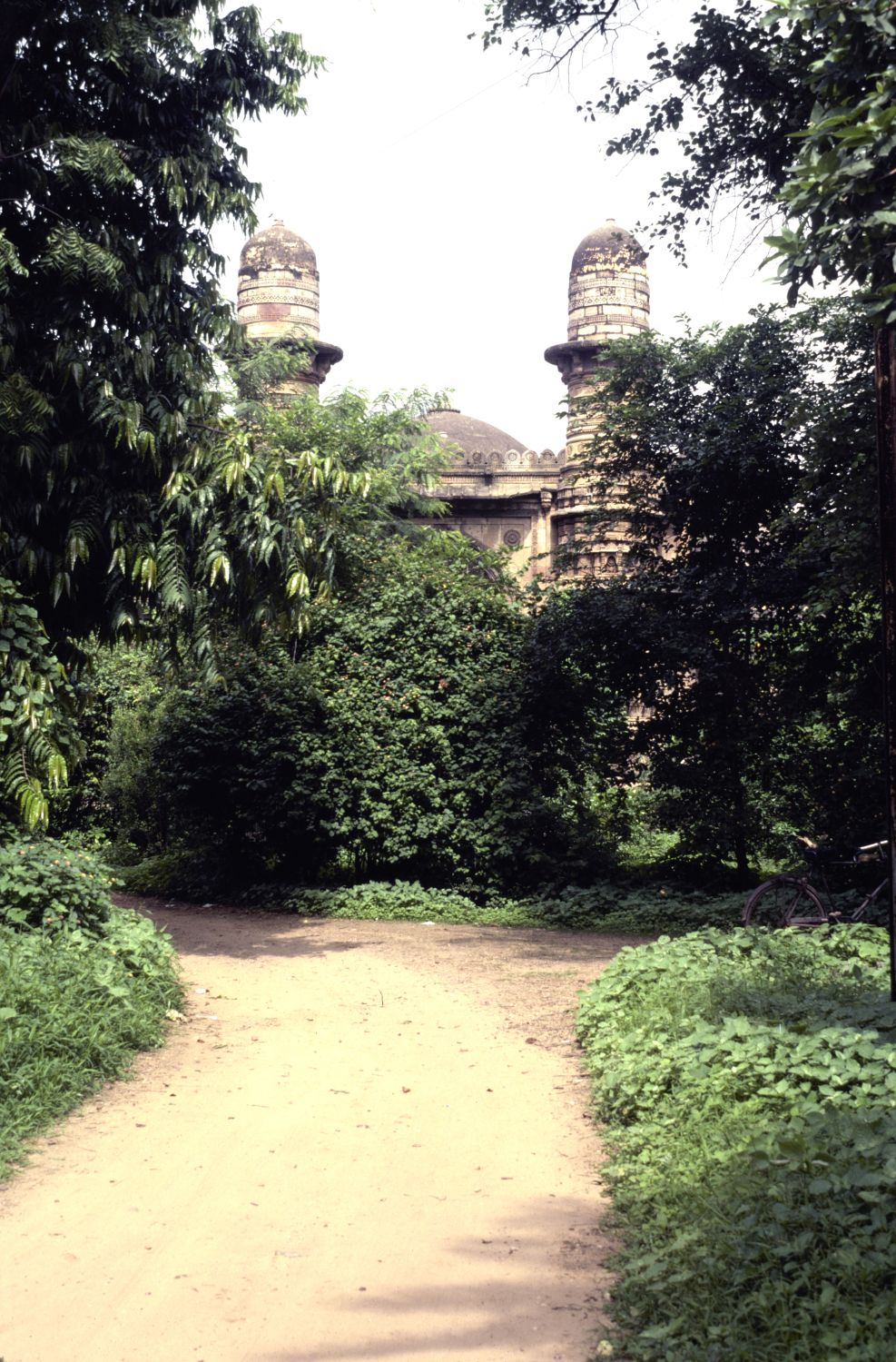 View of minarets over trees in garden from east.