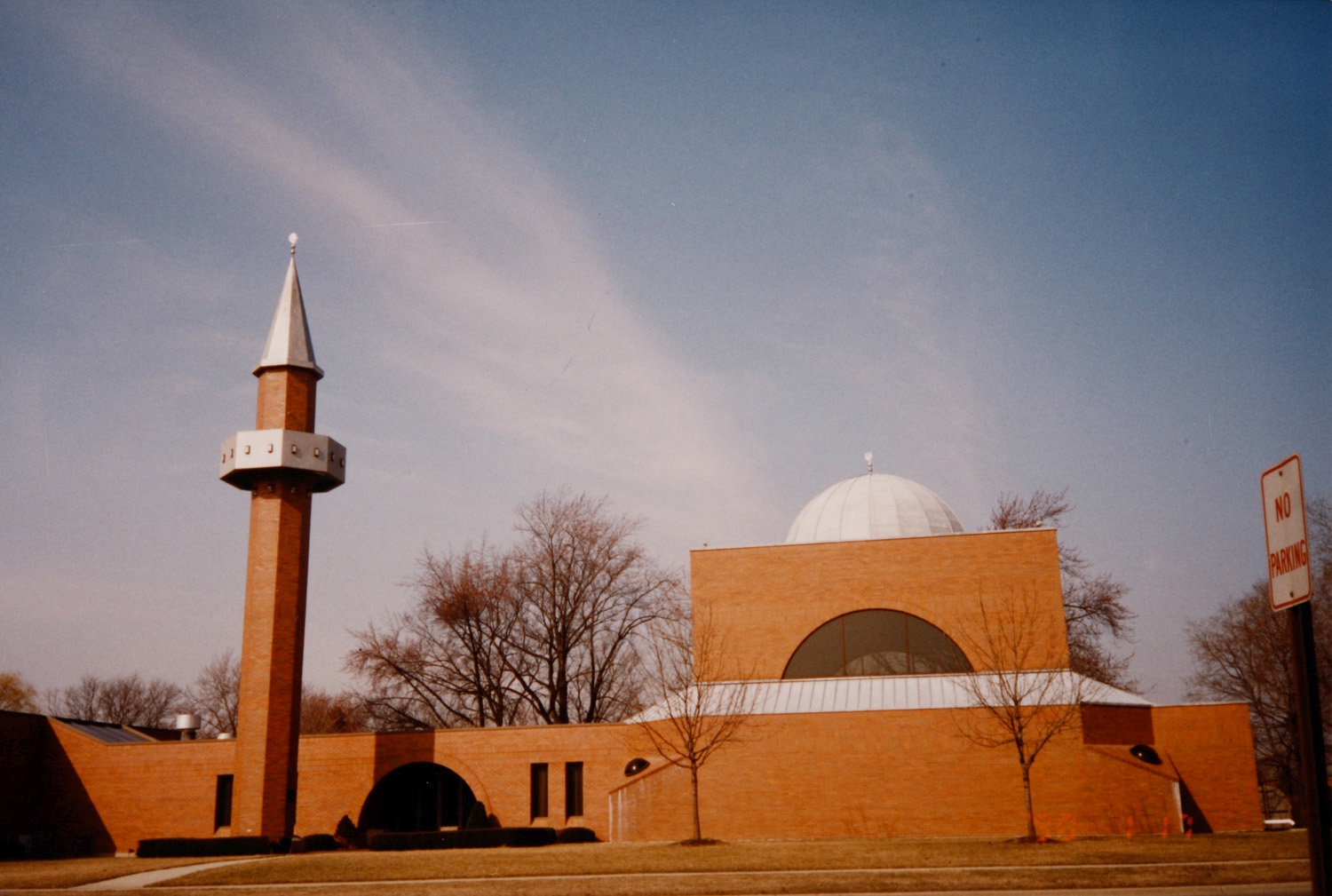 Exterior view, northern portion of front facade, with domed prayer hall and minaret