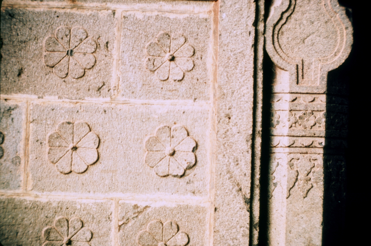 Exterior, detail of eight-petaled flower stone dado