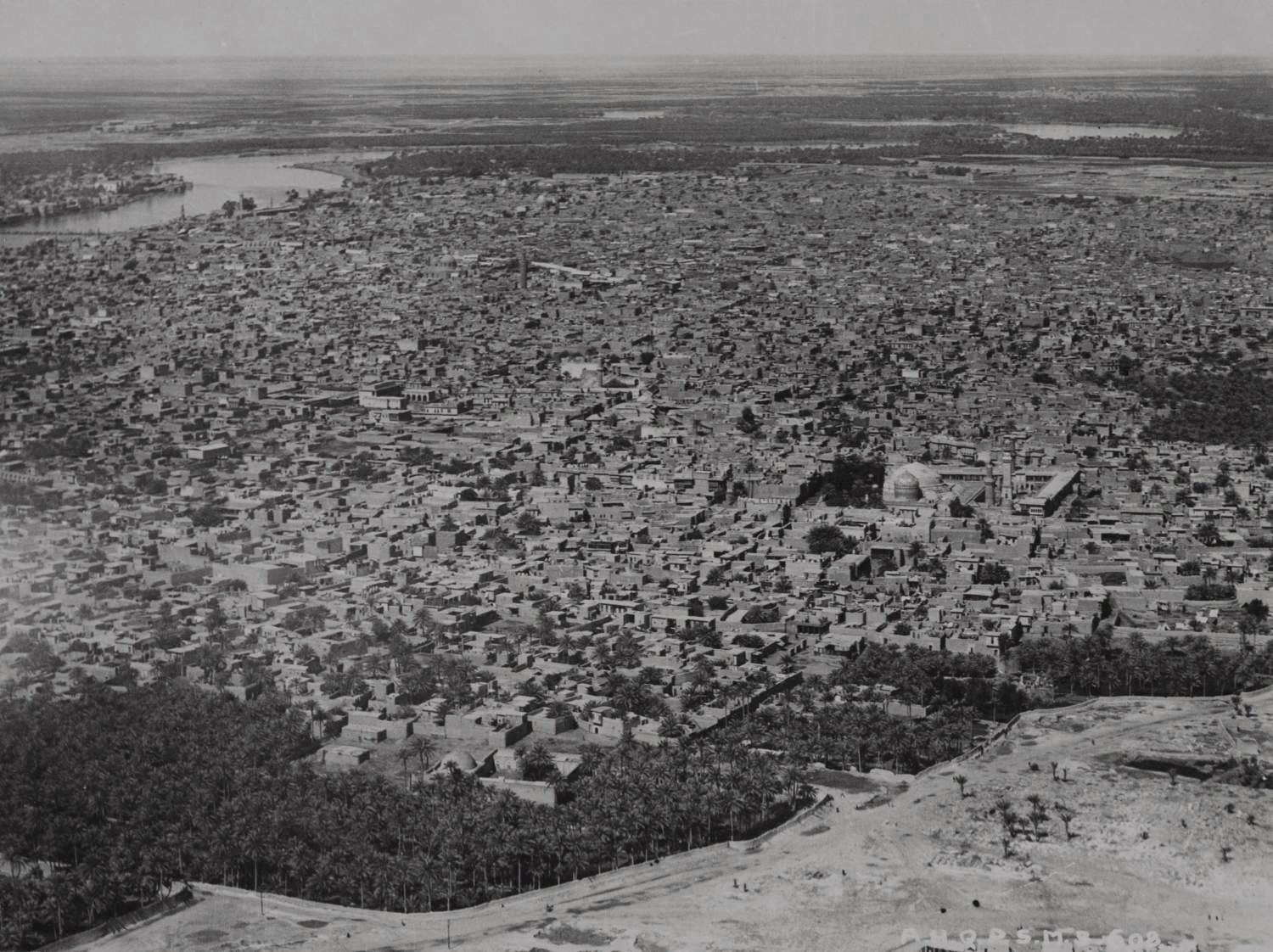 Jami' 'Abd al-Qadir al-Jaylani - Aerial view over Baghdad facing north, showing east bank of Tigris. 'Abd al-Qadir Jilani Shrine visible in foreground.