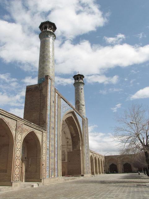 Exterior view from the enclosed central courtyard looking northeast, showing the northern iwan flanked by two minarets