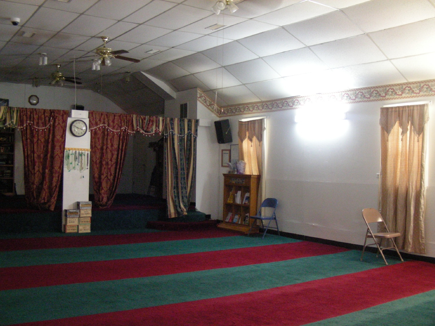 Prayer hall, looking towards the rear. The curtains separate the women's area.