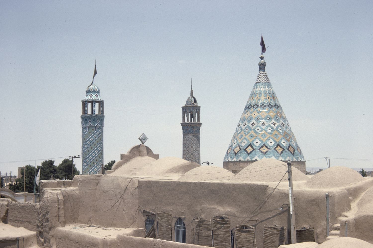 View of conical dome and minarets from a neighboring building.