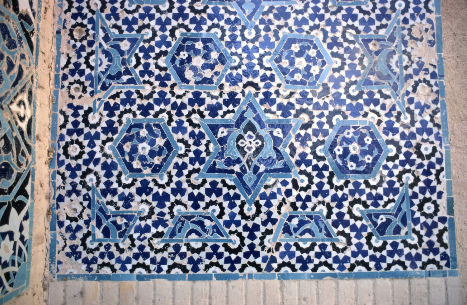 Darb-i Kushk Replica (Chihil Sutun Gardens) - Detail of re-mounted and restored tile mosaic panel from original site on back wall of iwan, to the left of doorway.