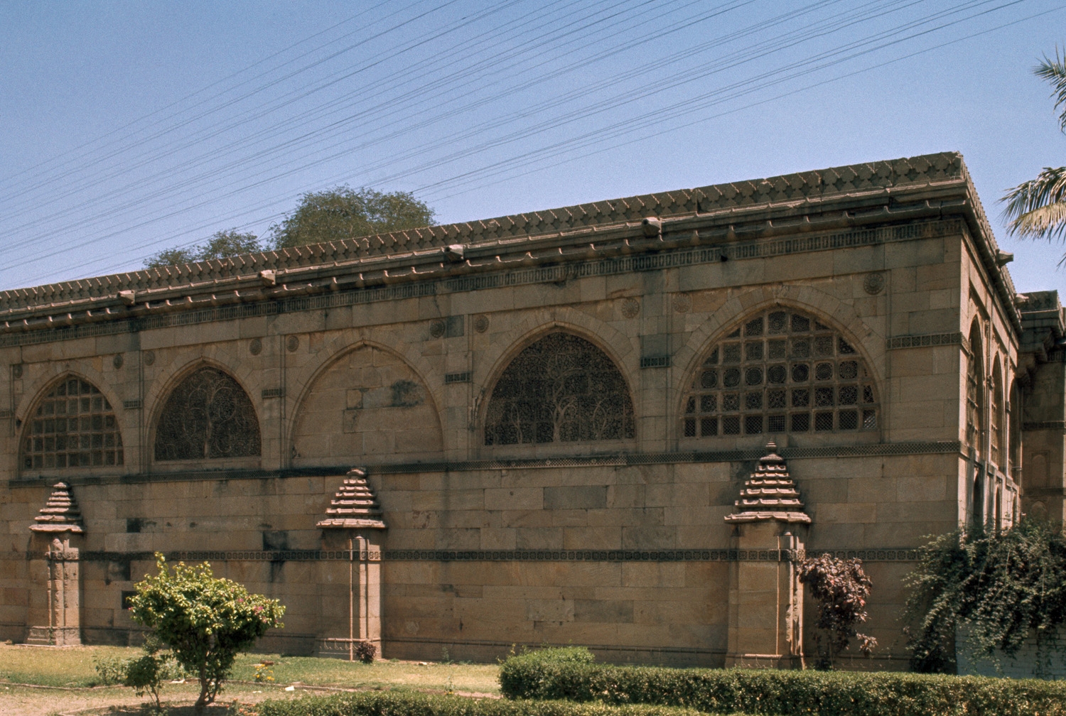 Exterior view, western elevation, showing carved windows