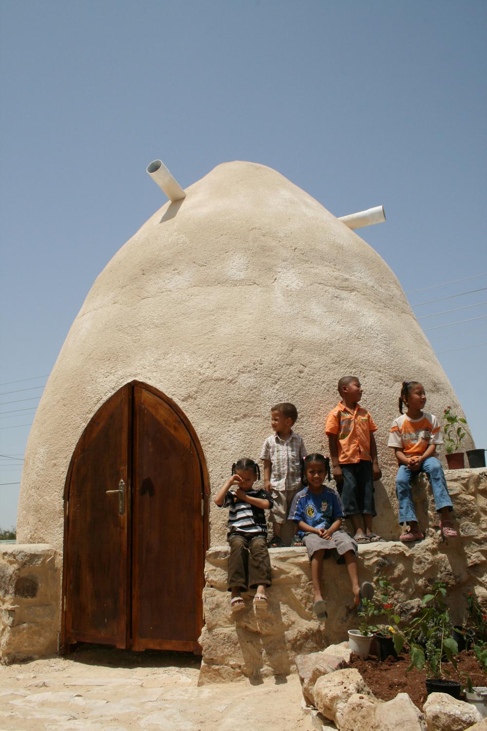 Earthbag dome and local children