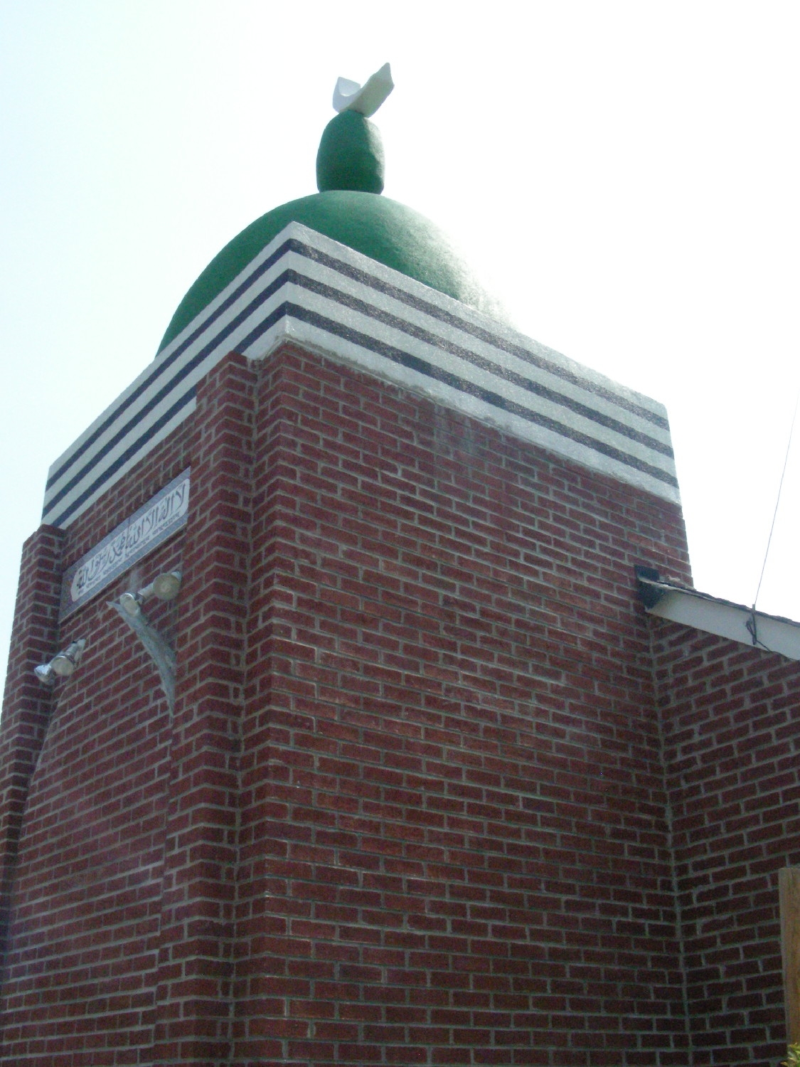 Front tower, topped with dome. Previously, this was the entrance to the former church.