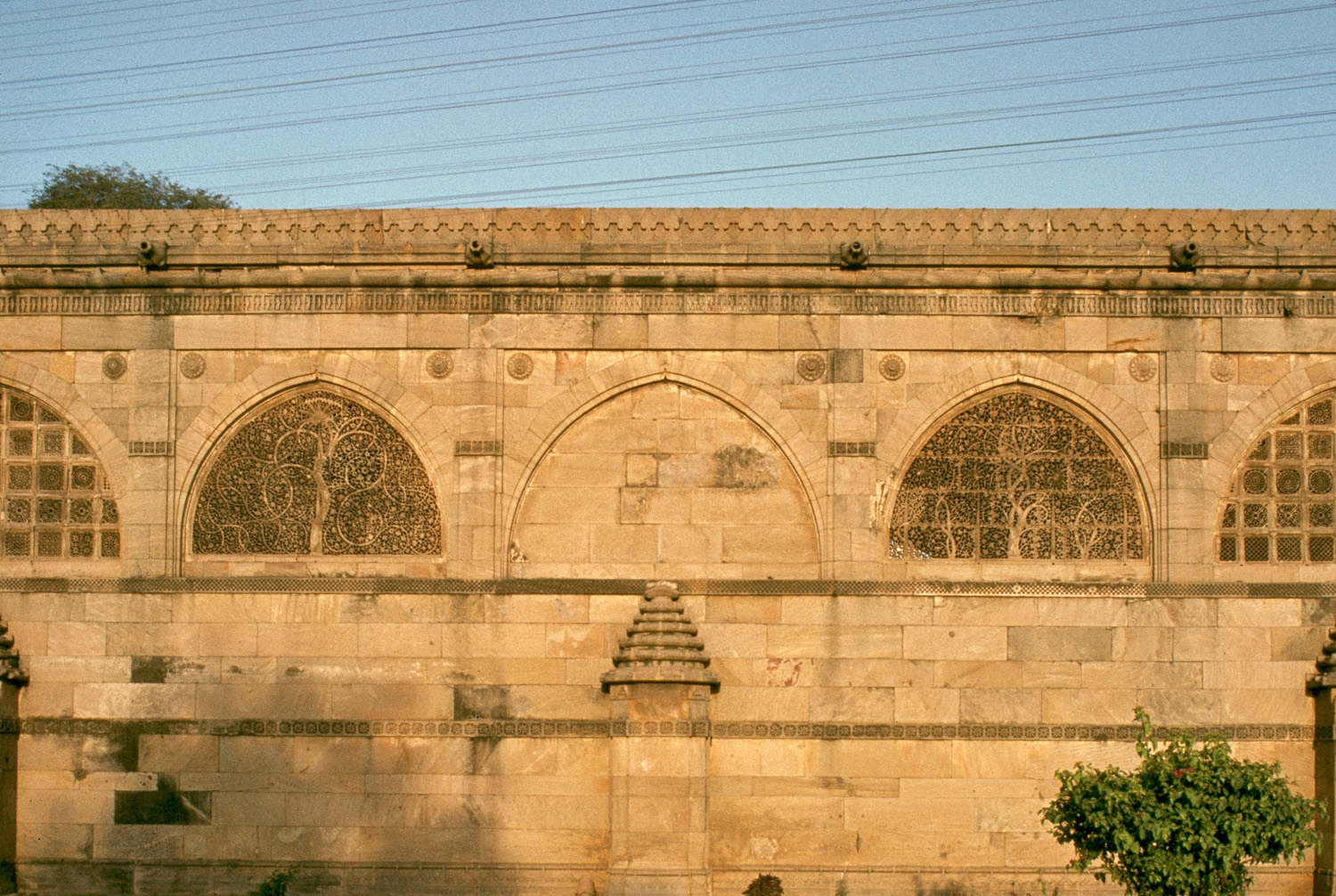 Exterior view, detail of western elevation, showing carved windows