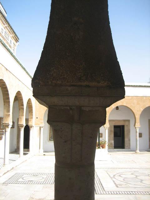 Detail of column capital supporting slightly pointed arches