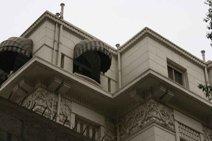 Detail view of the facade, frieze under the cornice with vegetal style patterns inspired by French Art Deco