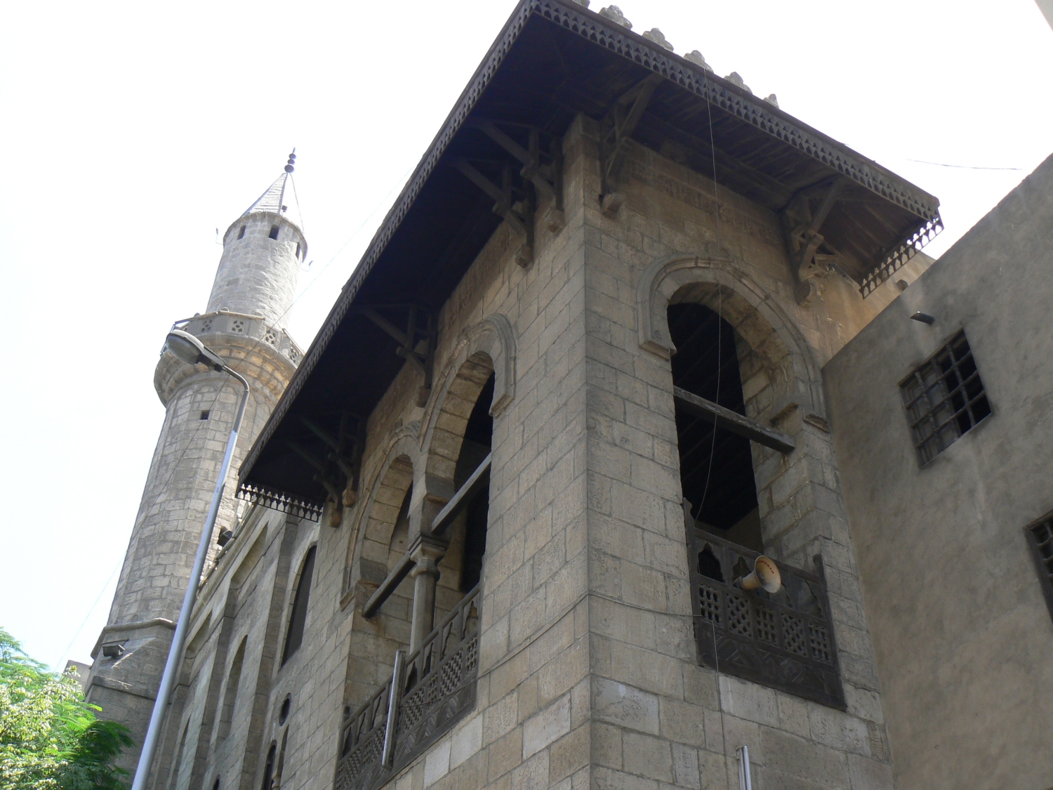 Upwards exterior view of the sabil-kuttab and minaret