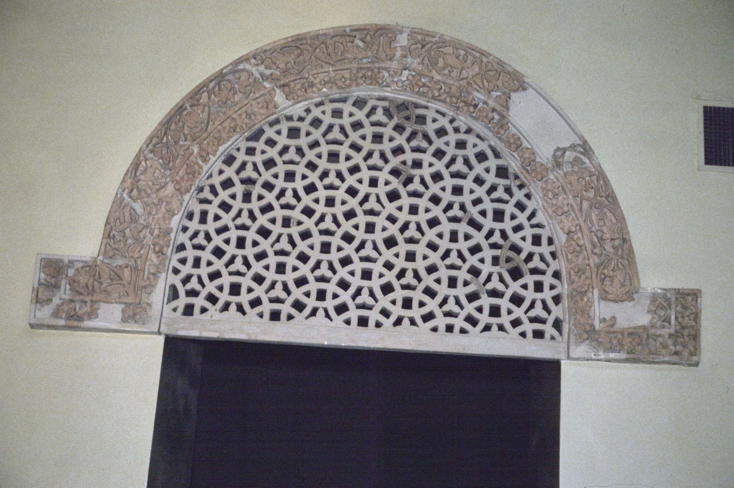 View of reconstructed stucco lunette and frieze from Qasr al-Hayr al-Gharbi in the National Museum of Damascus.