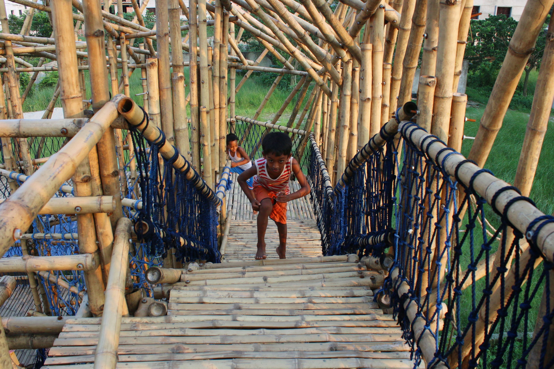 <p>Children exploring the bamboo playspace</p>