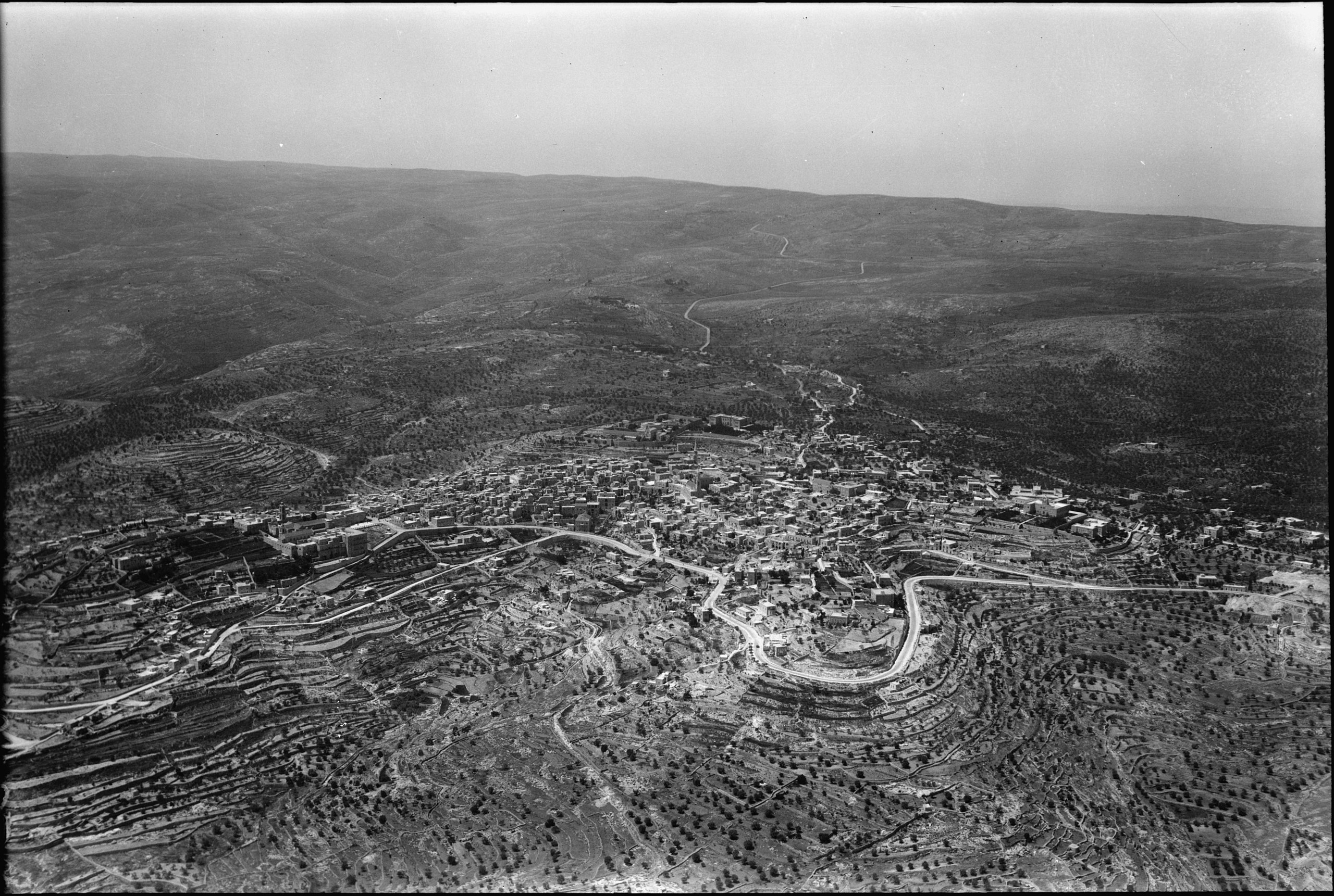 <p>An aerial view overlooking the town southward along the distant Hebron Road</p>