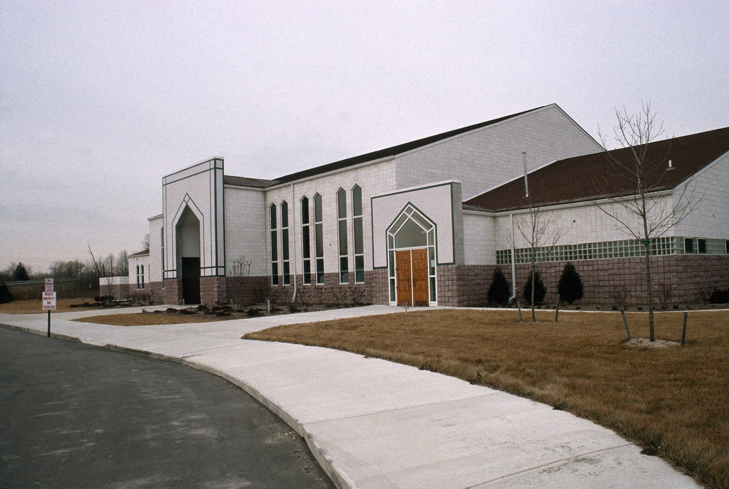 View looking southwest along front facade of school