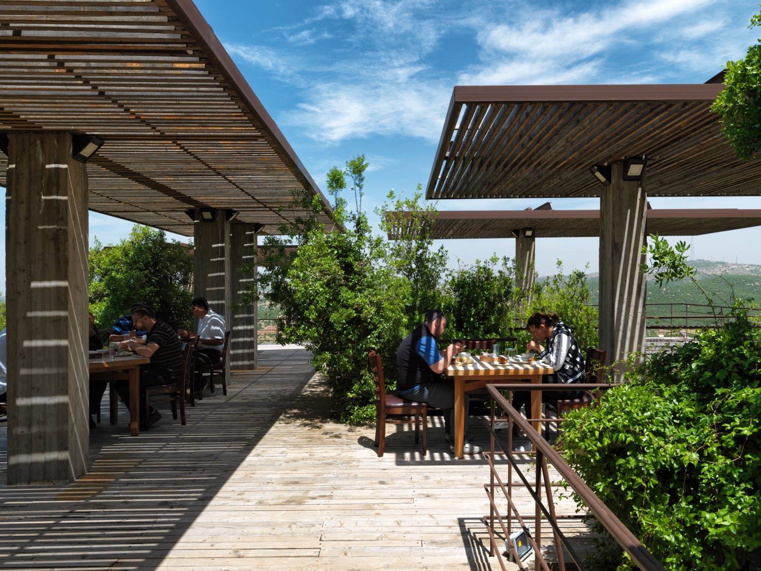 Restaurant terrace interacting with the oak forest, emphasising the main purpose of the academy to protect and spread awareness about the threatened rare forests in Jordan