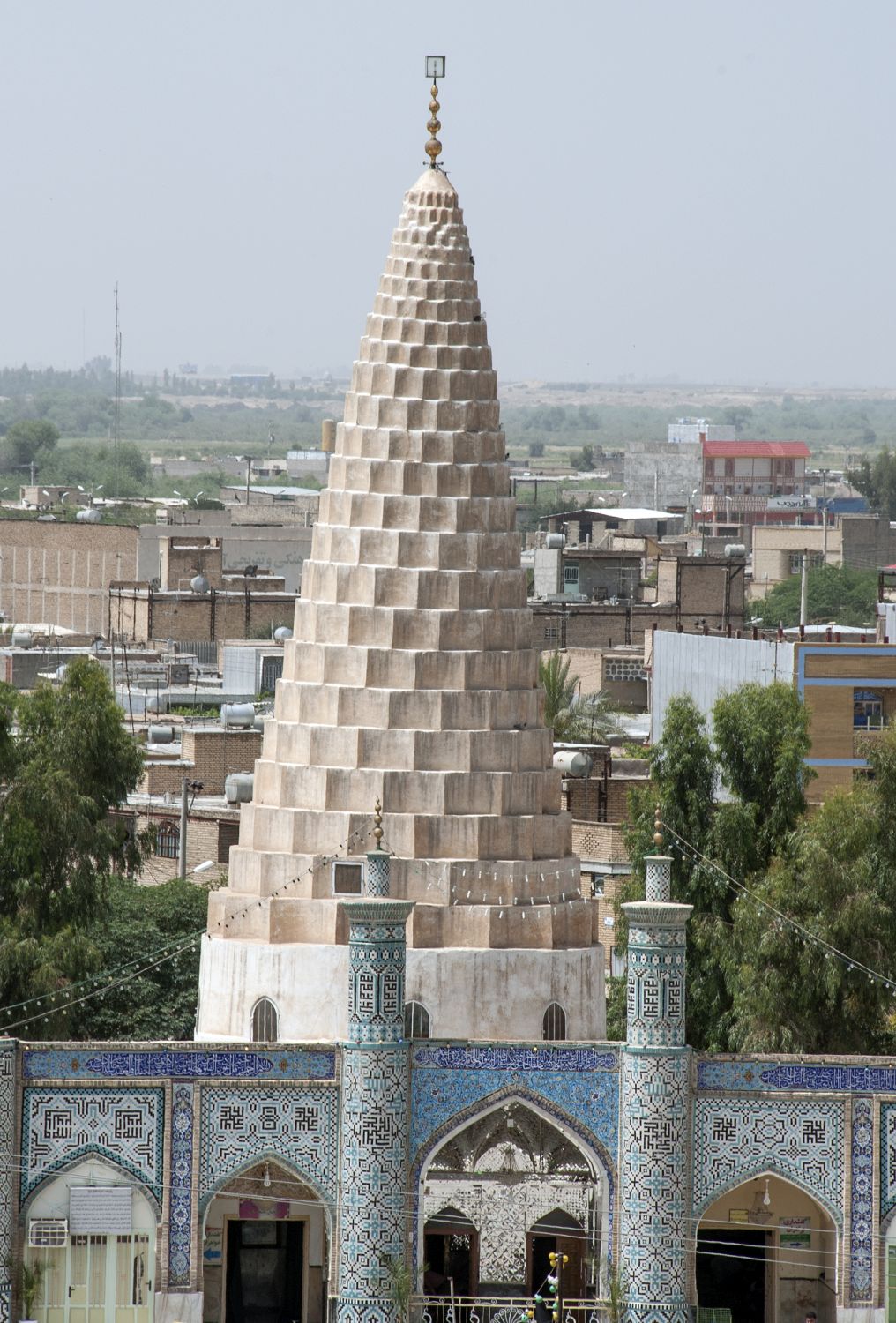 View of muqarnas dome over tomb chamber from a distance.