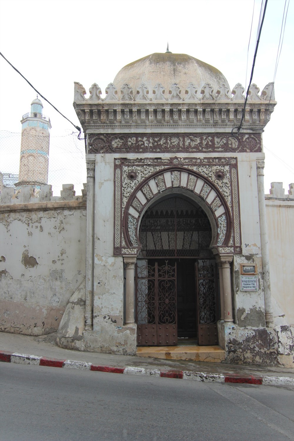 Exterior view of the main entrance and octogonal minaret 